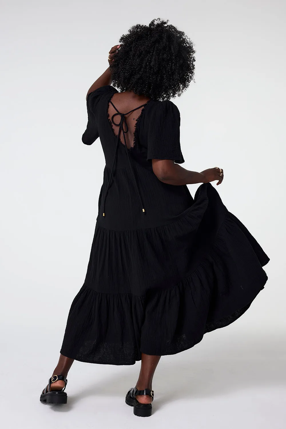 Gentle Glow Sleek And Stylish Black Flute Sleeve Tiered Midi Dress